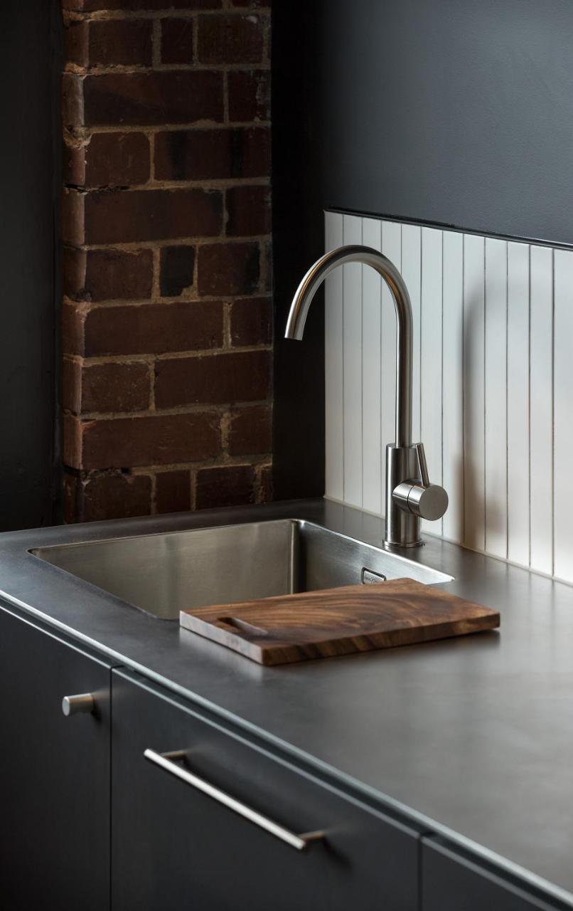 The Chamberson Hotel Dunedin Exterior foto A kitchen sink with a wooden cutting board